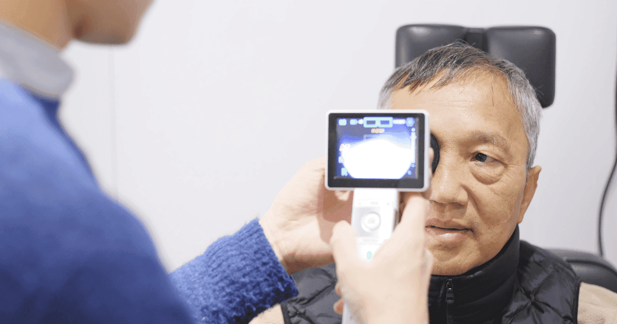 Patient undergoing diabetic eye screening with retinal imaging